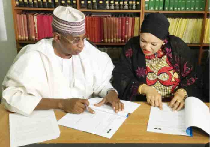 MD, NNCMC, Abubakar Musa and his counterpart at the NCX, Mrs Zaheera Baba-Ari while signing a partnership for trading agric produce in the country.